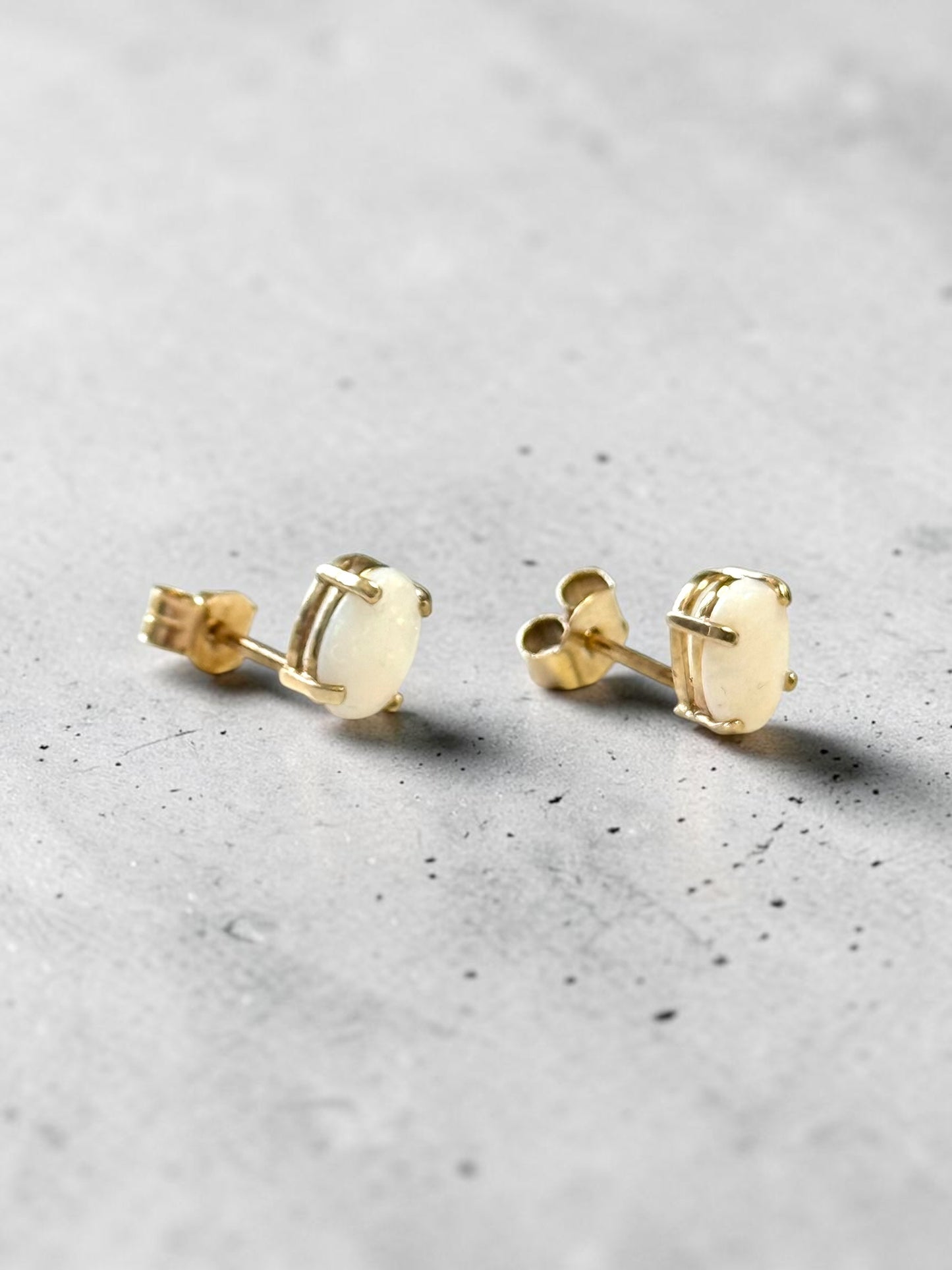 0.86ct Oval Opal 6mm x 4mm Earrings In 10k Yellow Gold