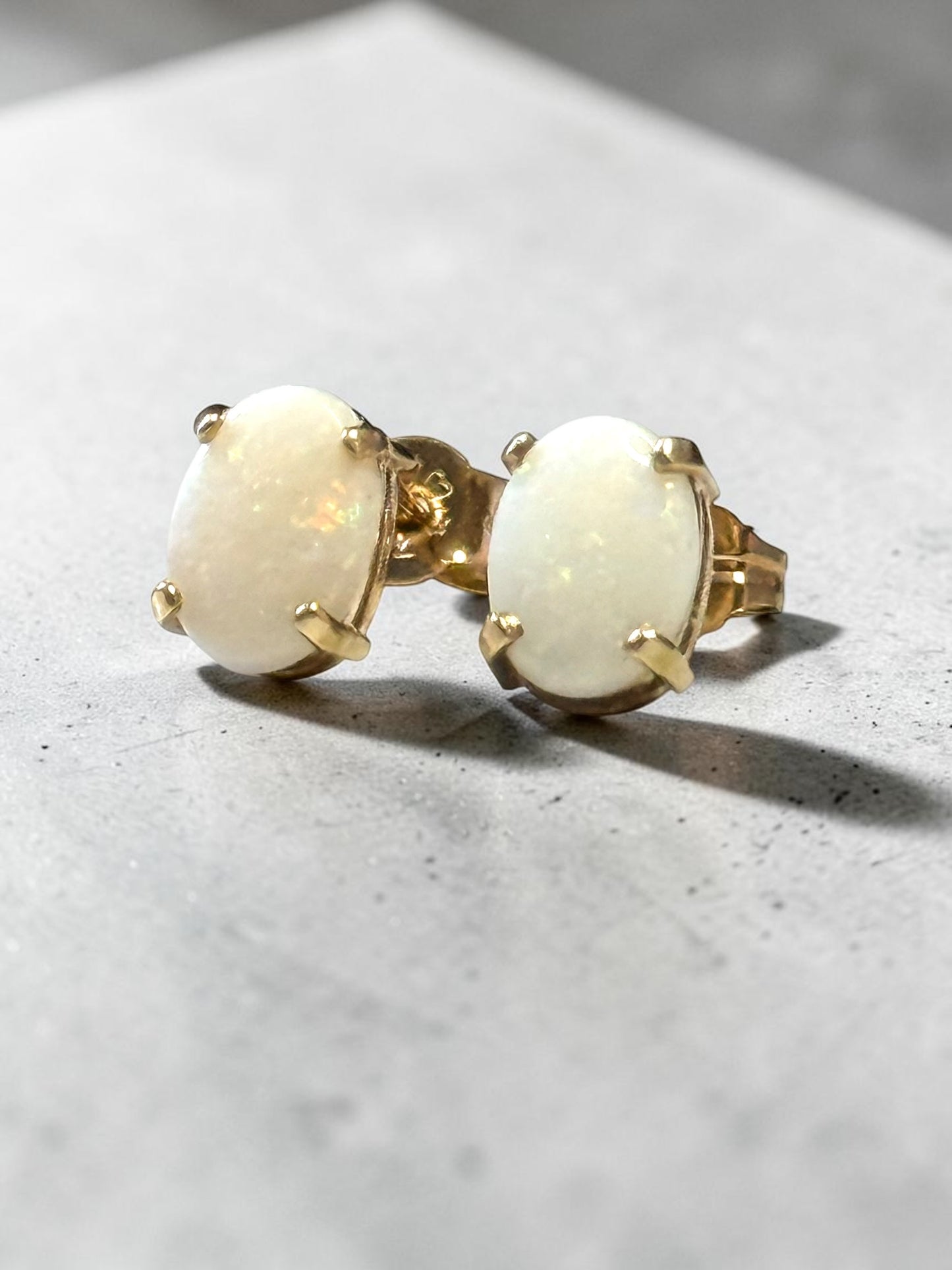 0.86ct Oval Opal 6mm x 4mm Earrings In 10k Yellow Gold